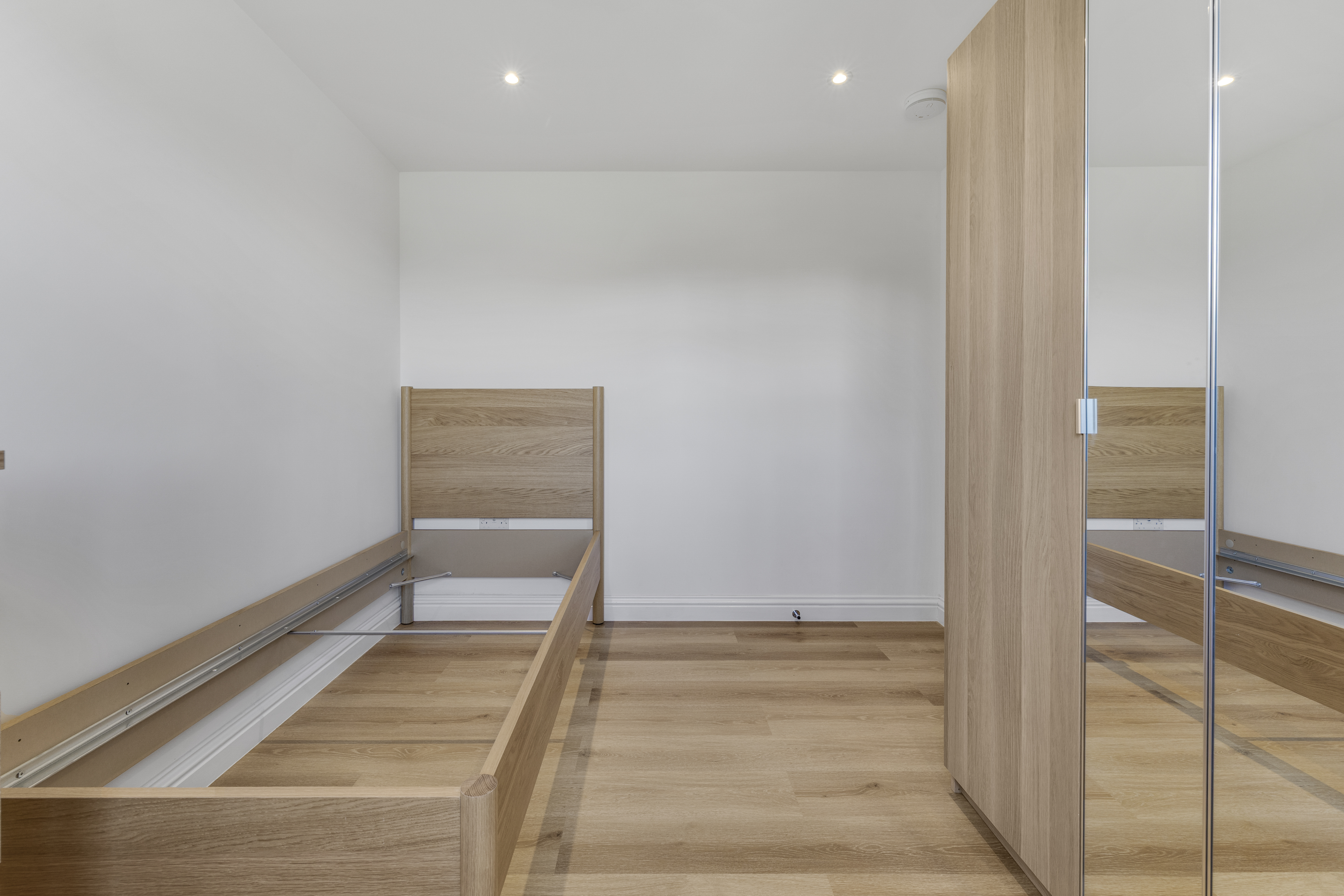 Bespoke garden annexe Interior Design with modern appliances and clean worktops