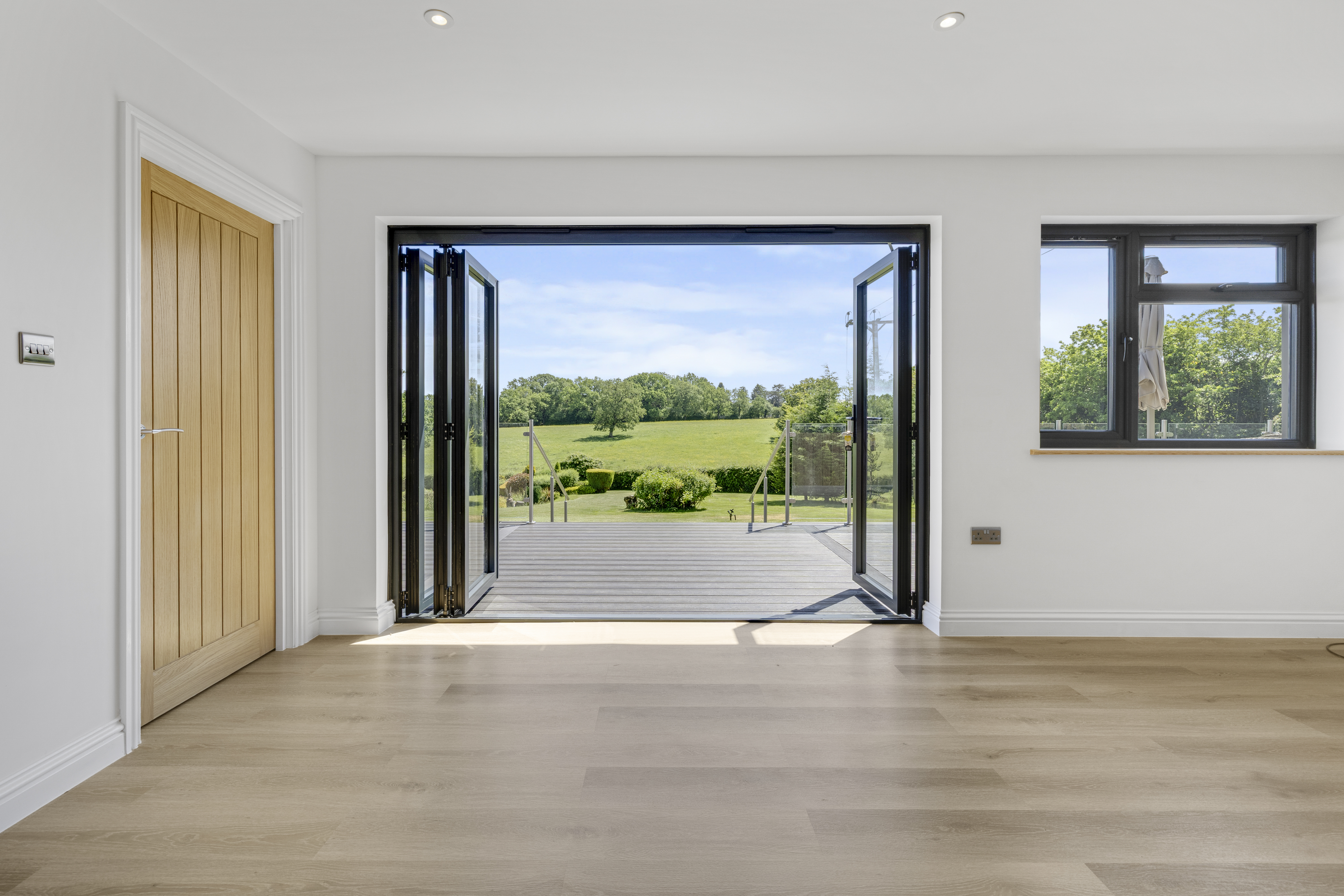 Bespoke garden annexe Interior Design with modern appliances and clean worktops