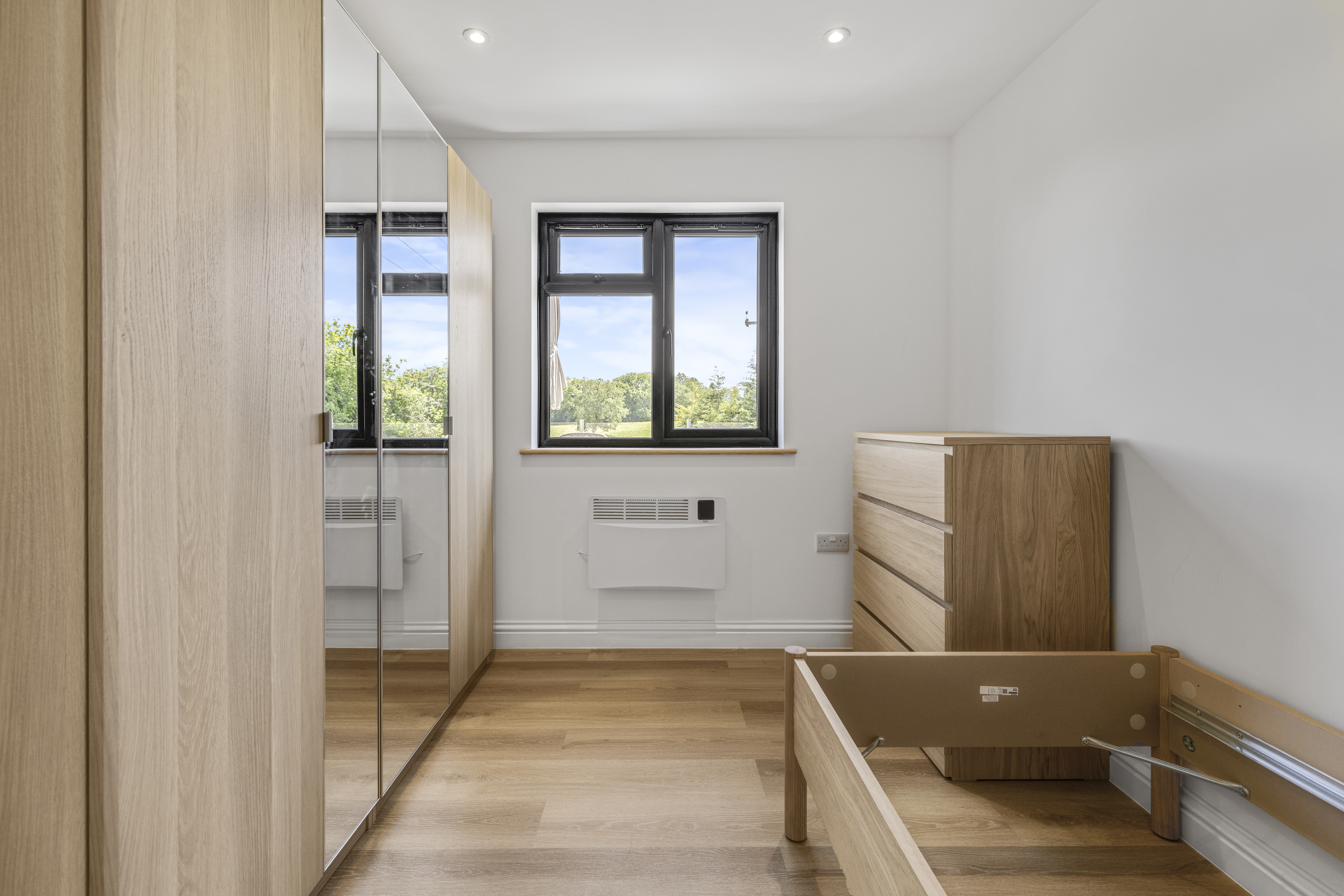 Bespoke garden annexe Interior Design with modern appliances and clean worktops