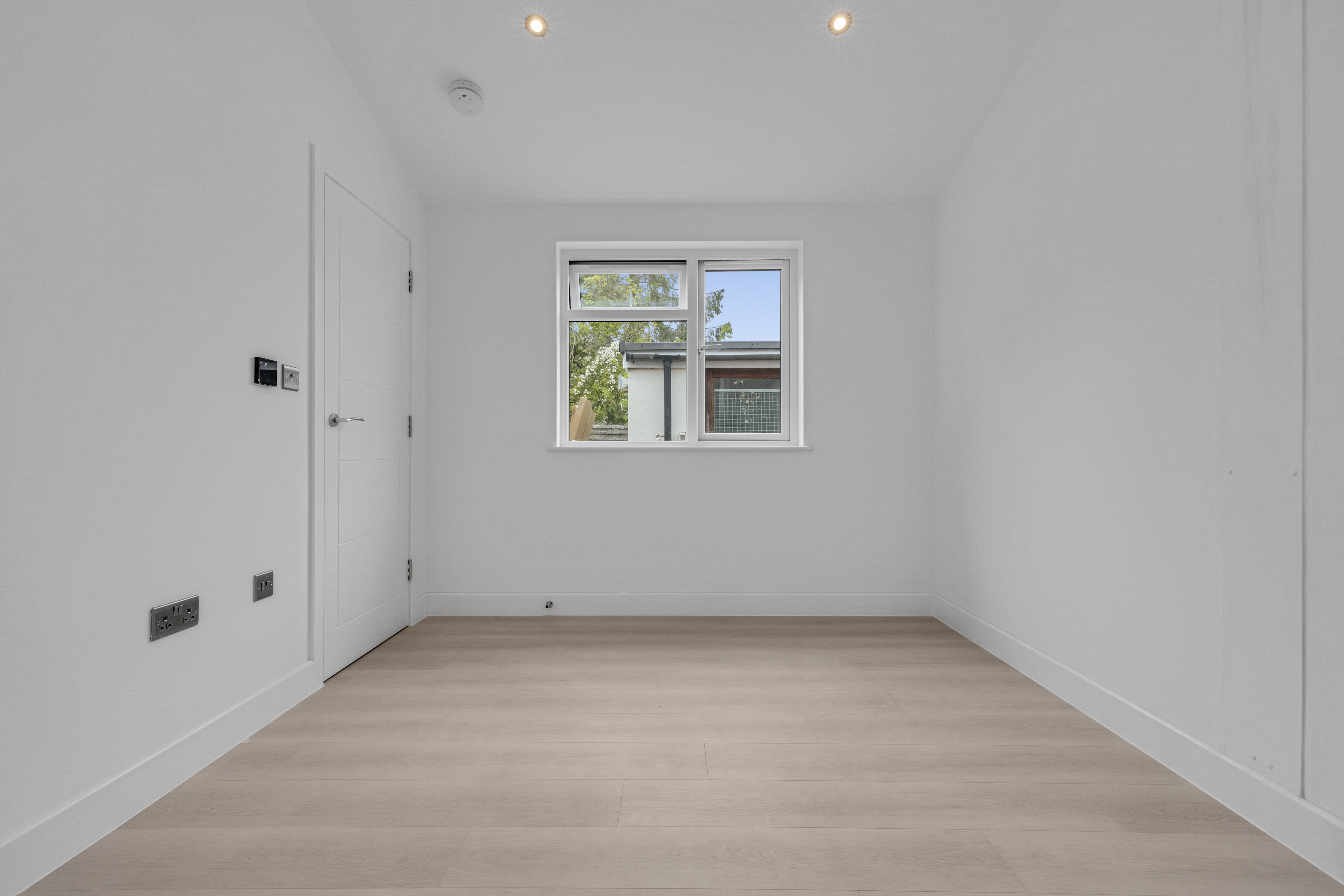 Bespoke garden annexe Interior Design with modern appliances and clean worktops