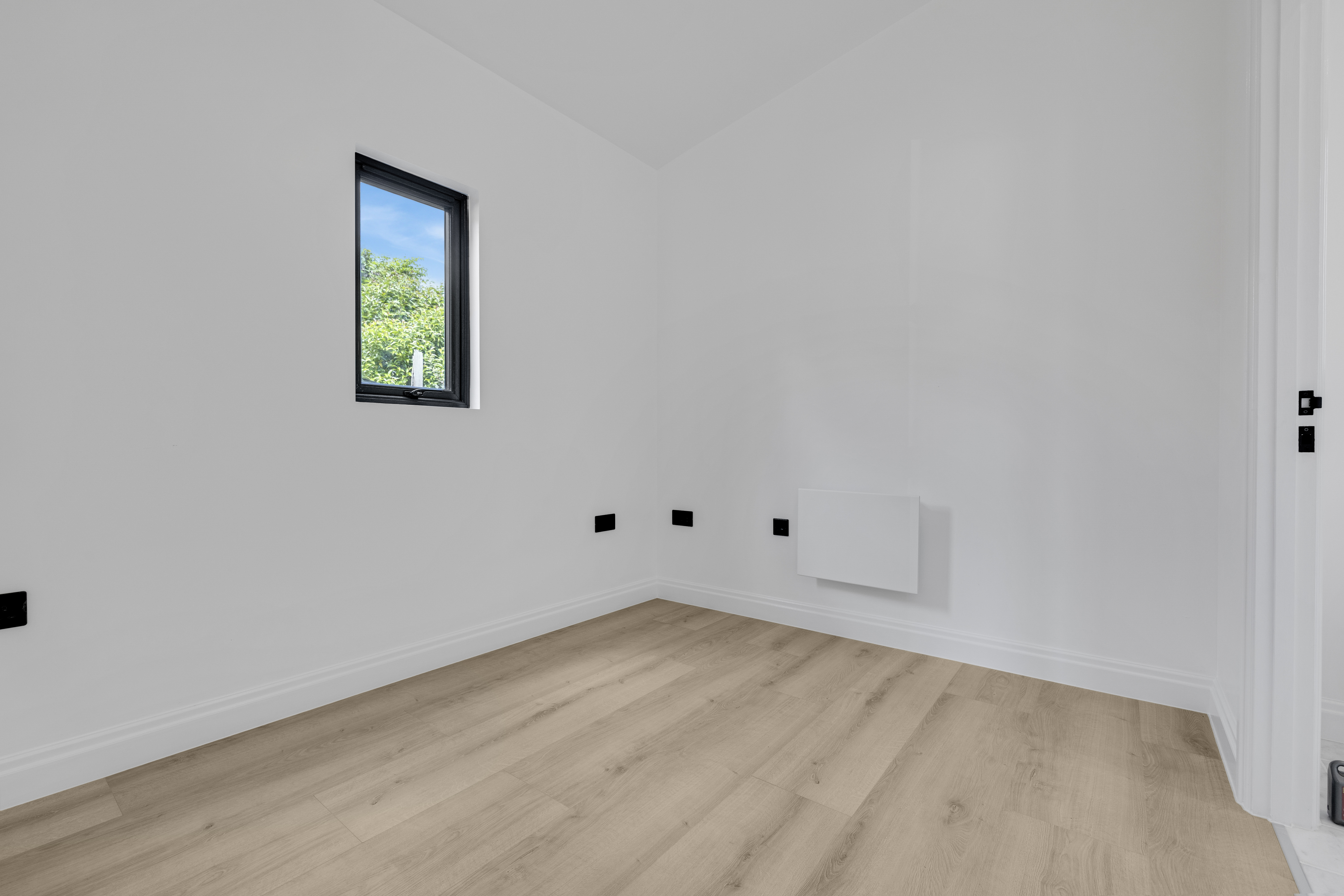 Bespoke garden annexe Interior Design with modern appliances and clean worktops