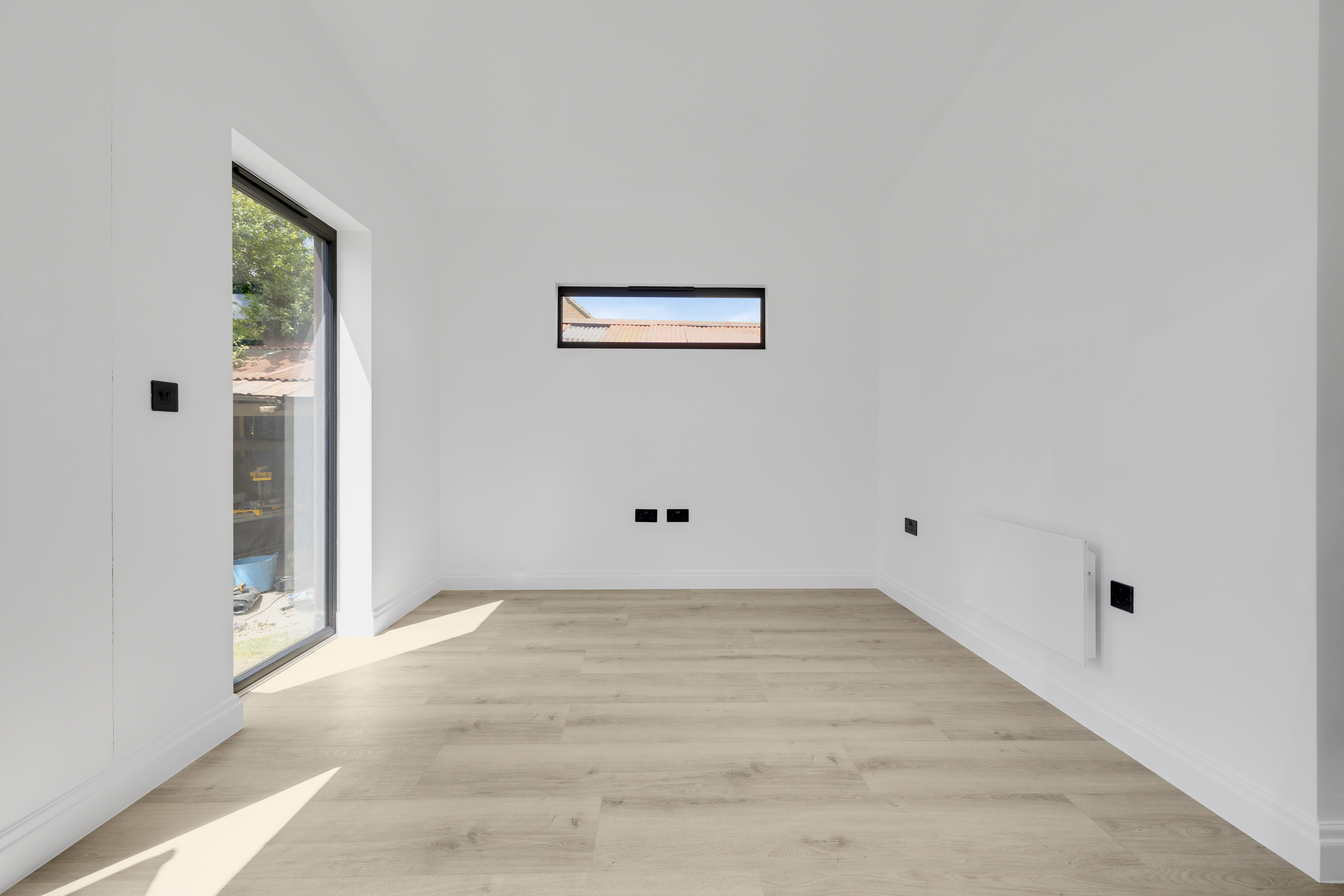 Bespoke garden annexe Interior Design with modern appliances and clean worktops