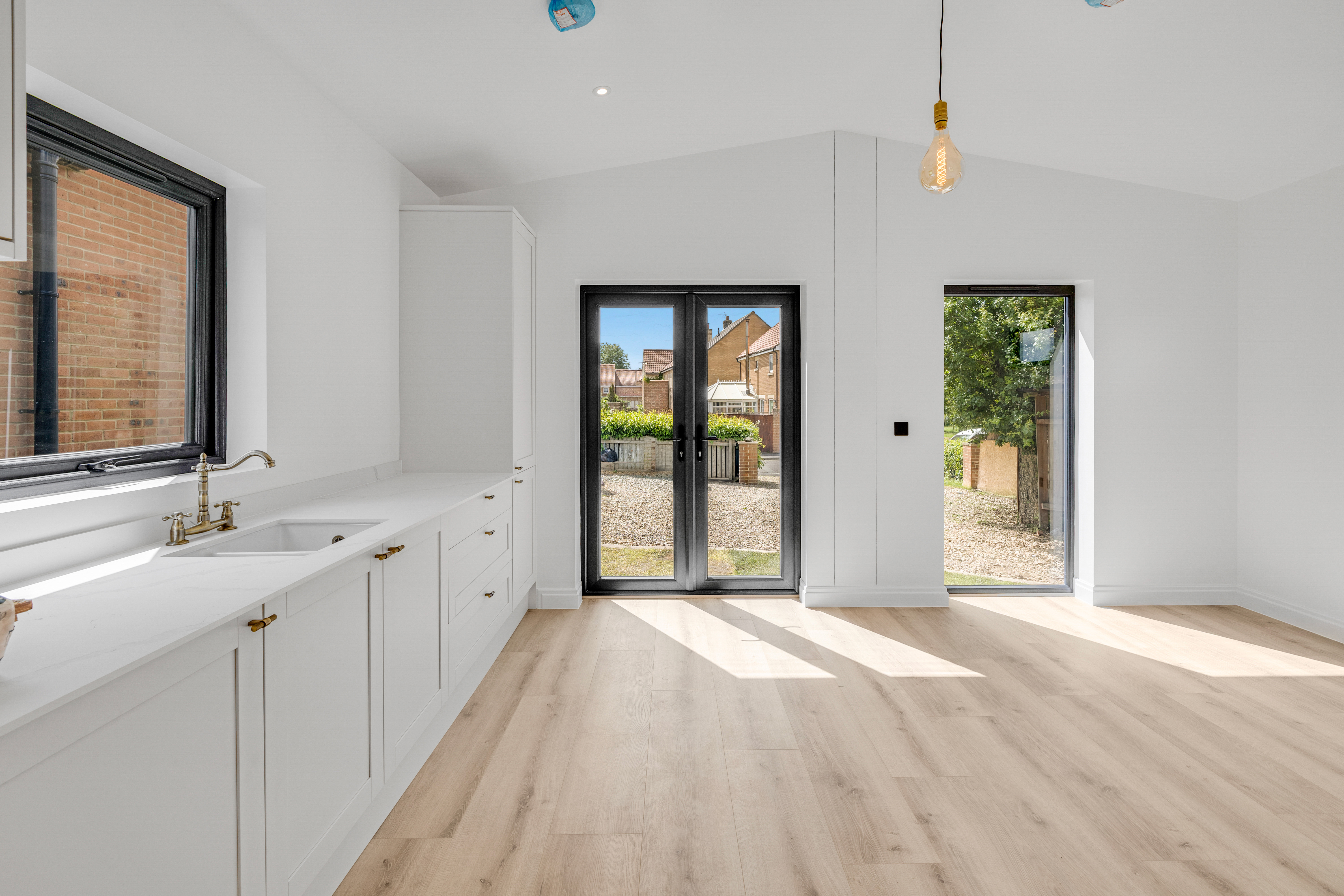 Bespoke garden annexe Interior Design with modern appliances and clean worktops