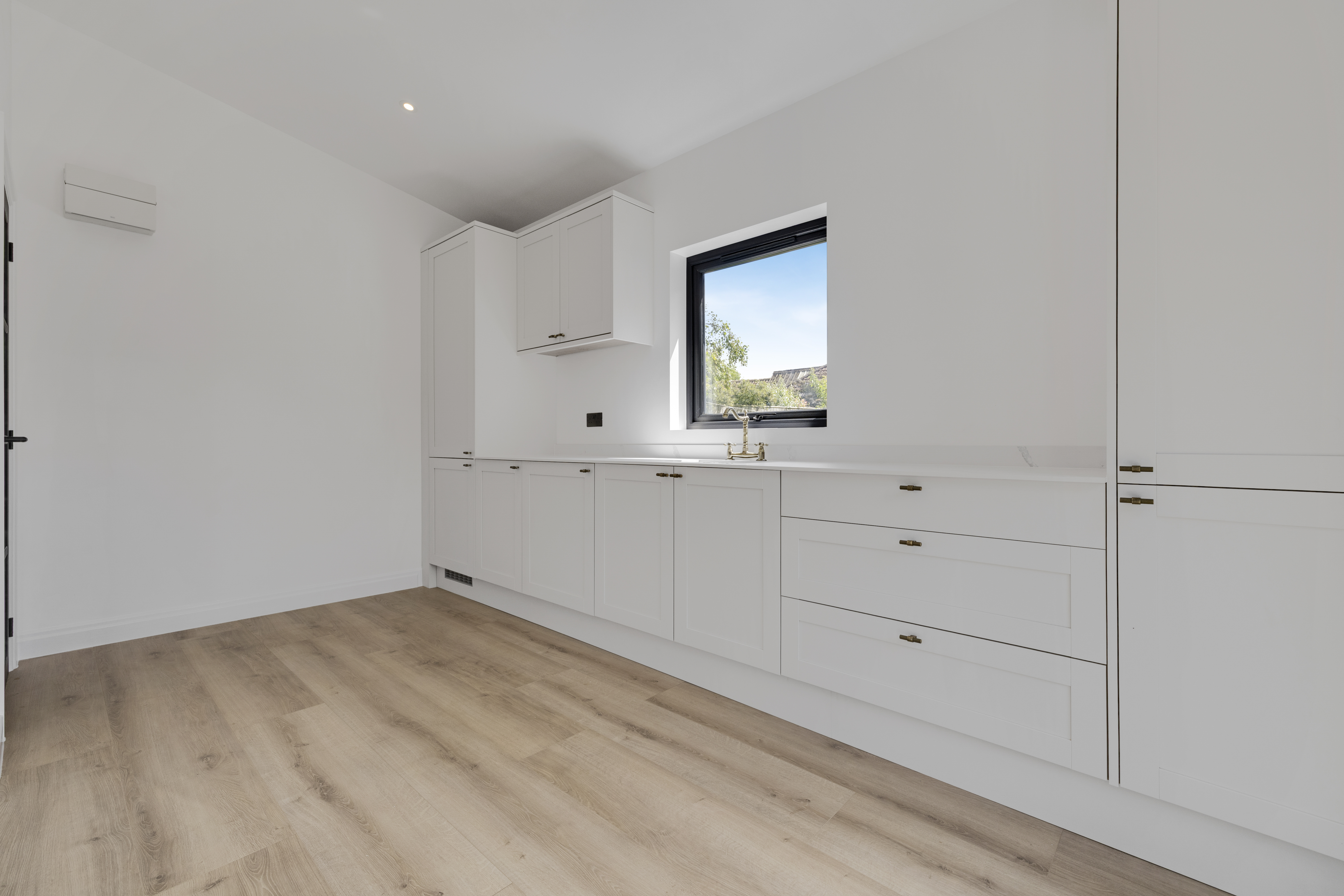 Bespoke garden annexe Interior Design with modern appliances and clean worktops