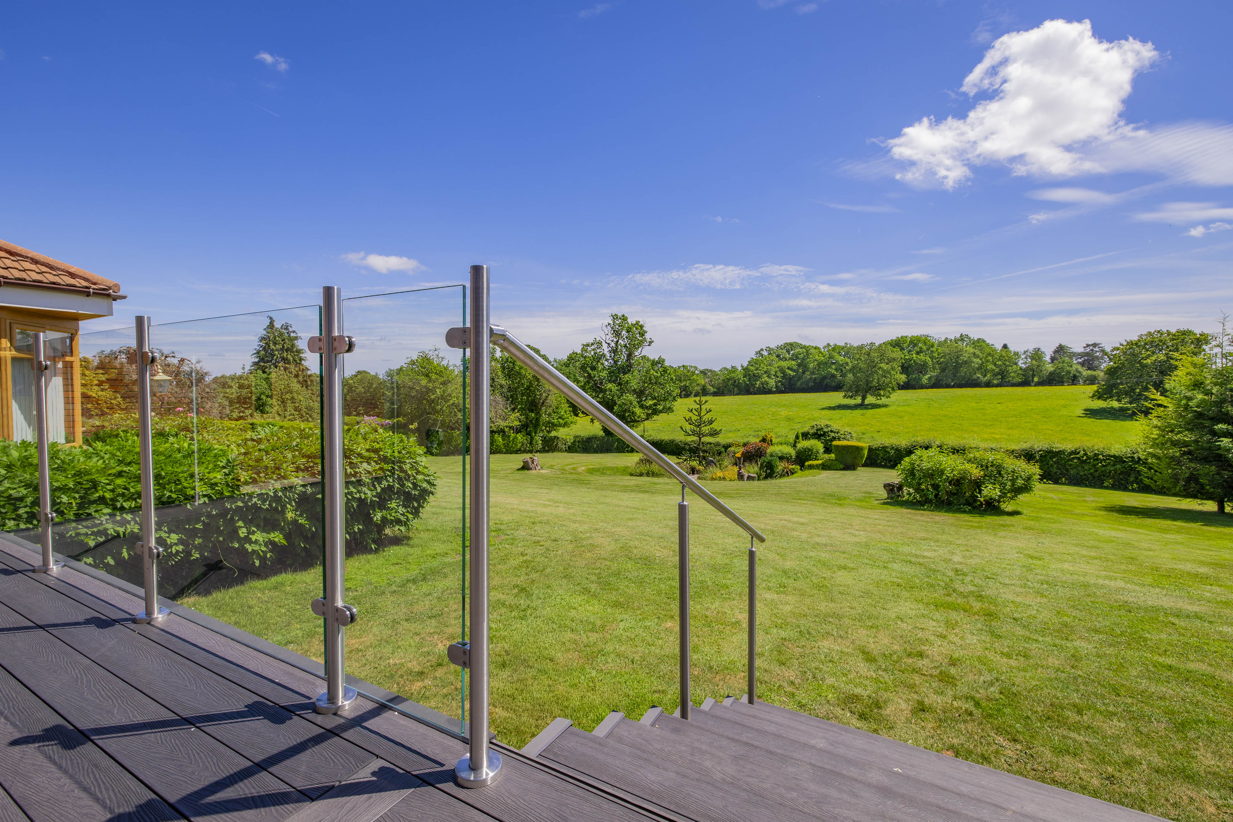Bespoke garden annexe Exterior Design with modern appliances and clean worktops