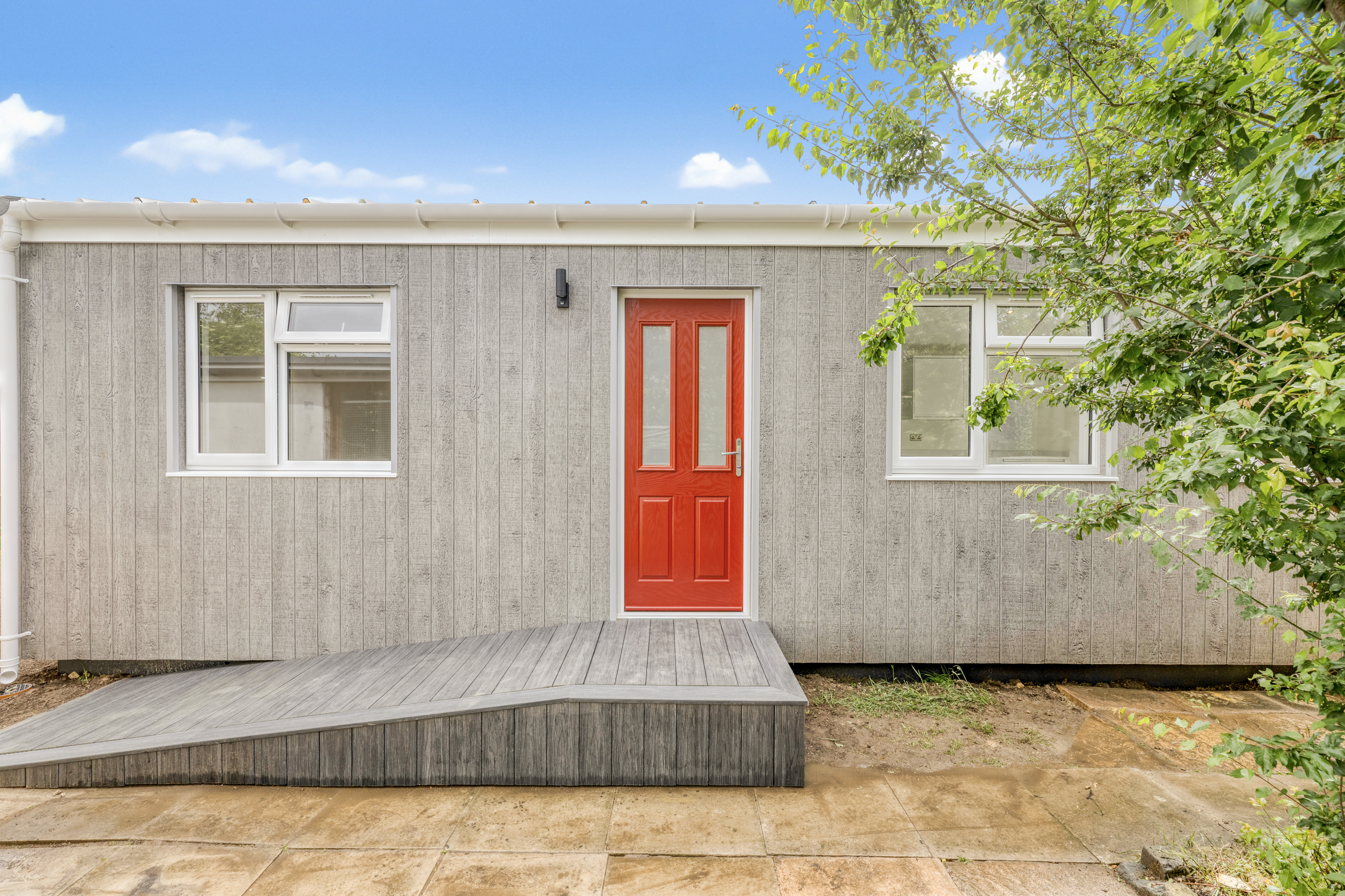 Bespoke garden annexe Exterior Design with modern appliances and clean worktops