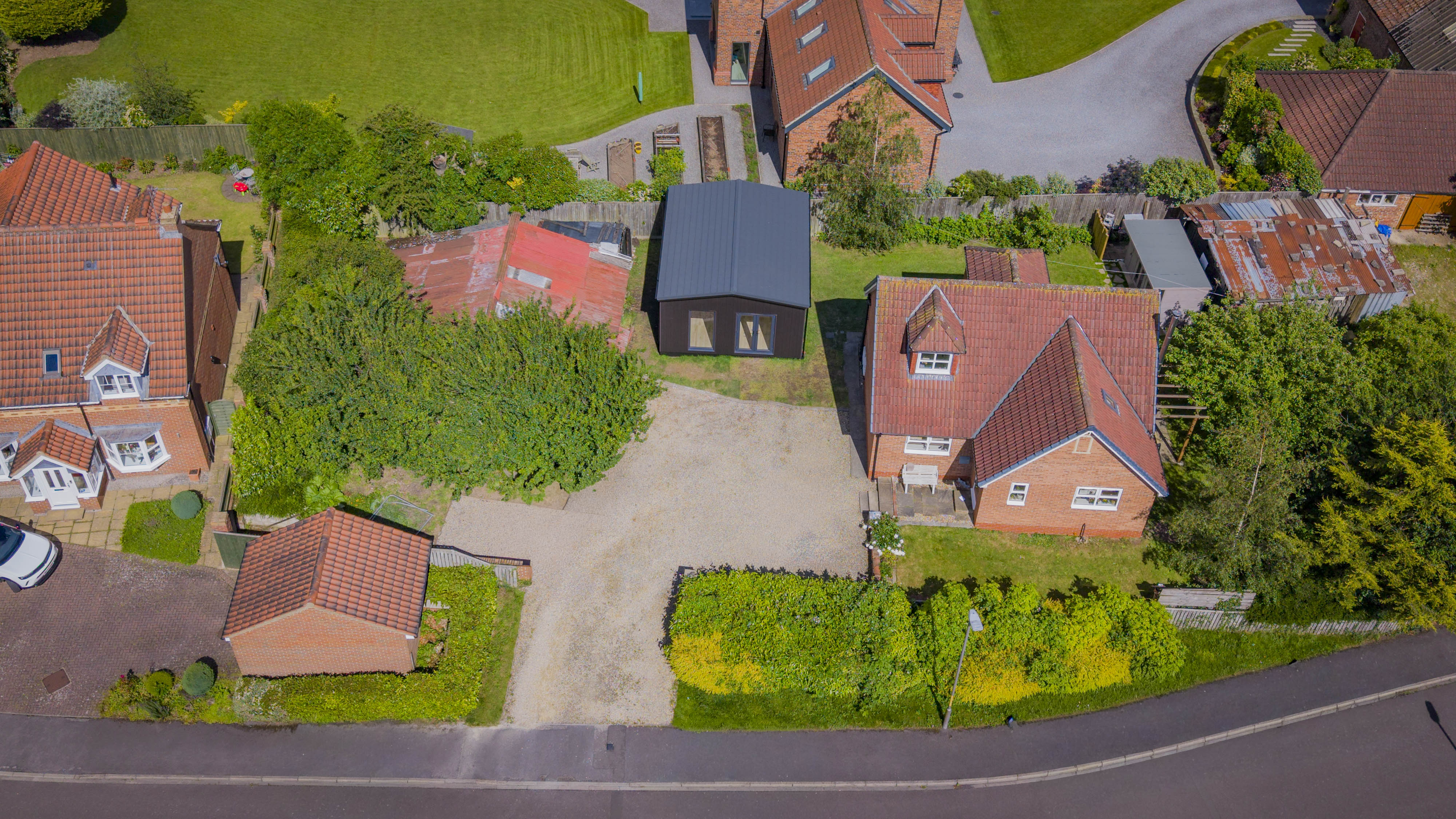 Bespoke garden annexe kitchen with modern appliances and clean worktops