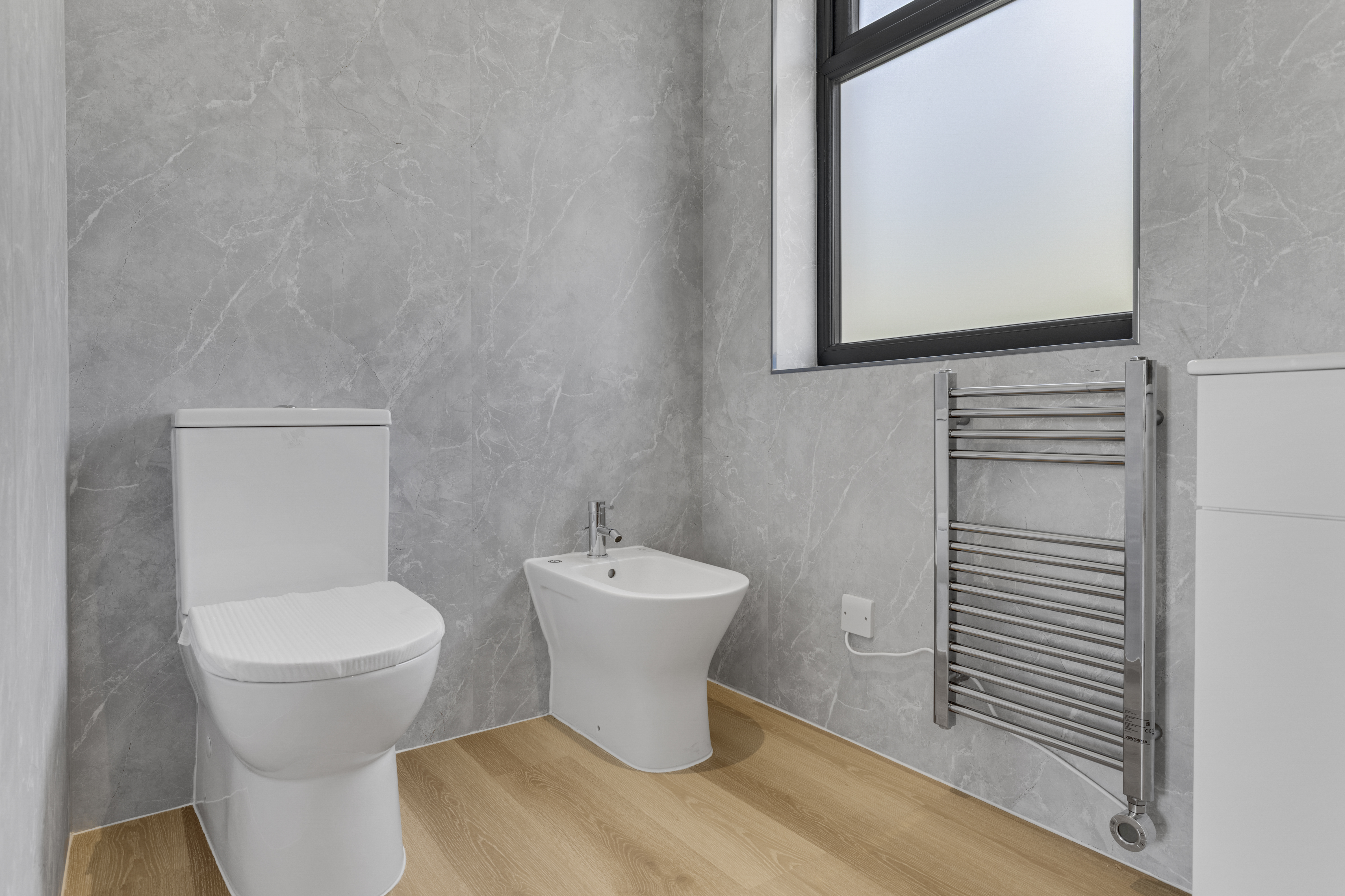 Bespoke garden annexe Washroom Design with modern appliances and clean worktops