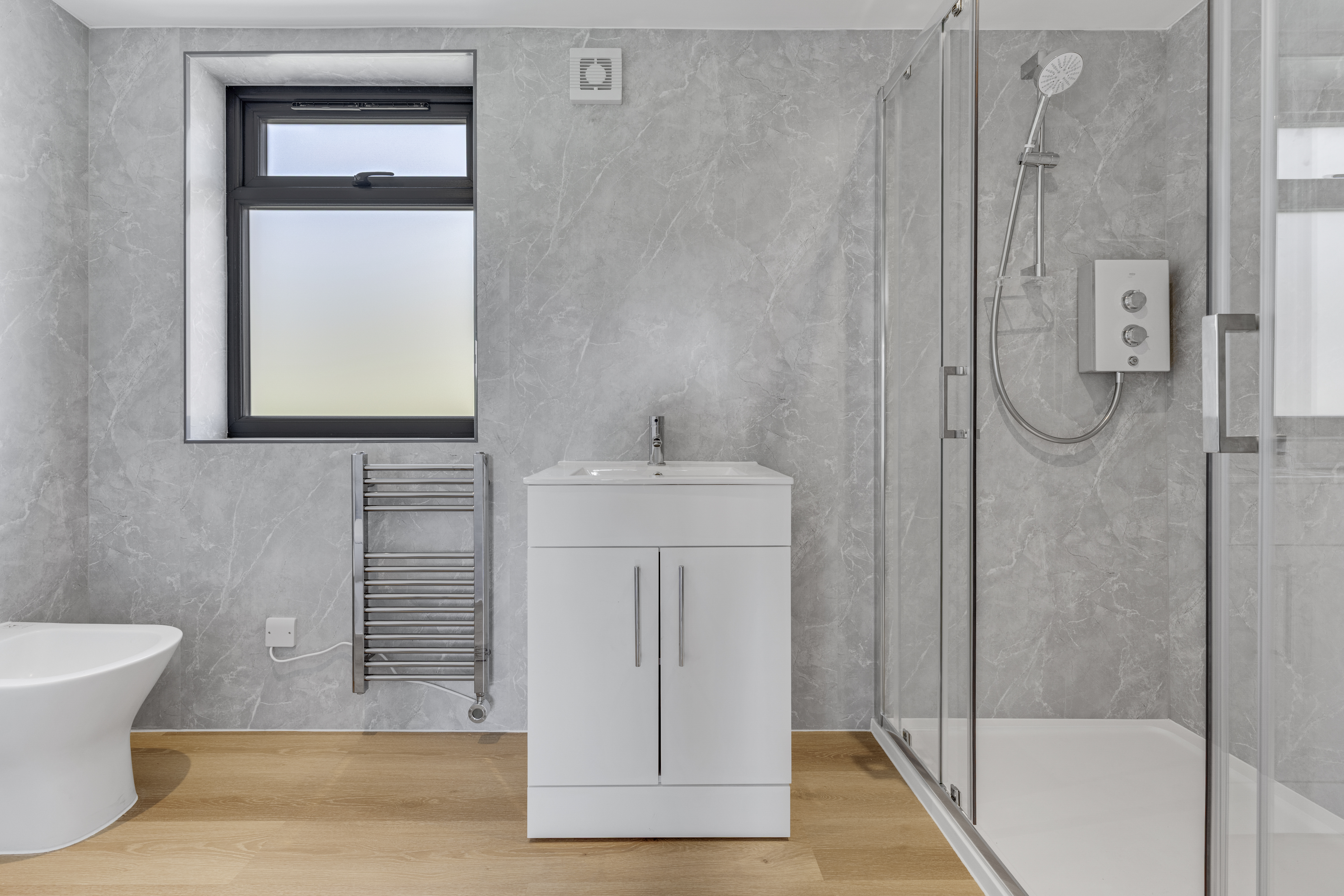 Bespoke garden annexe Washroom Design with modern appliances and clean worktops