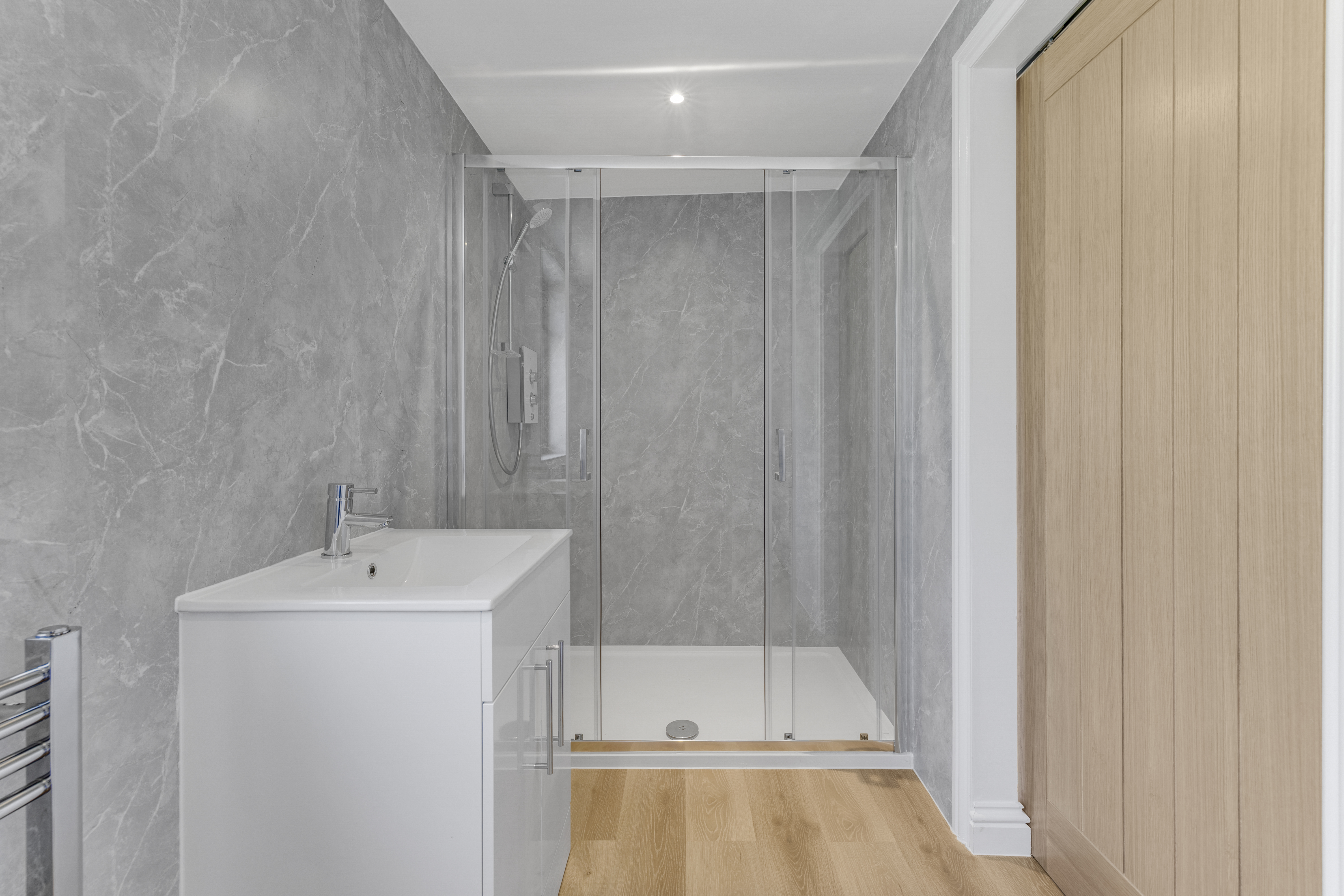 Bespoke garden annexe Washroom Design with modern appliances and clean worktops