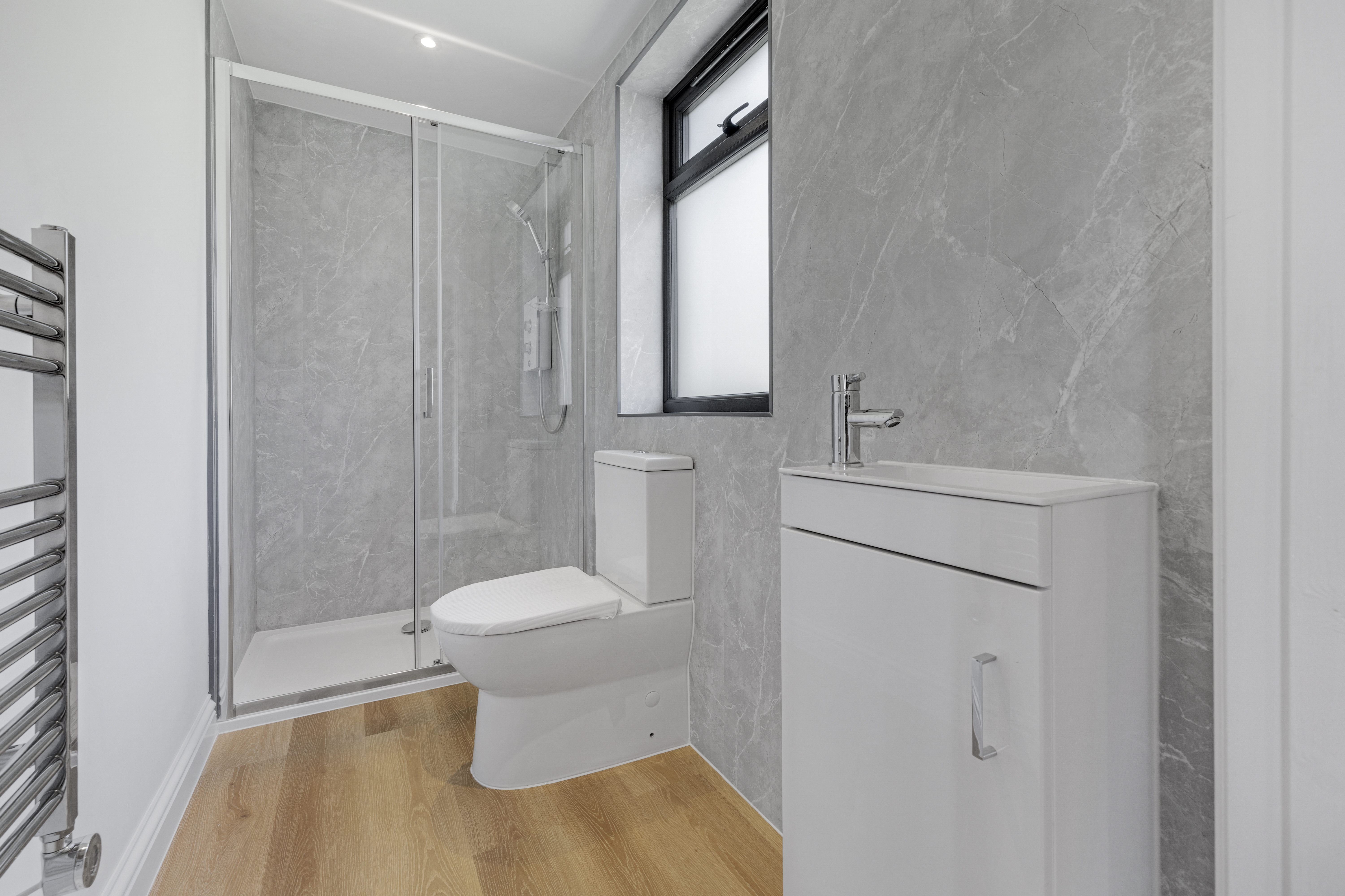 Bespoke garden annexe Washroom Design with modern appliances and clean worktops