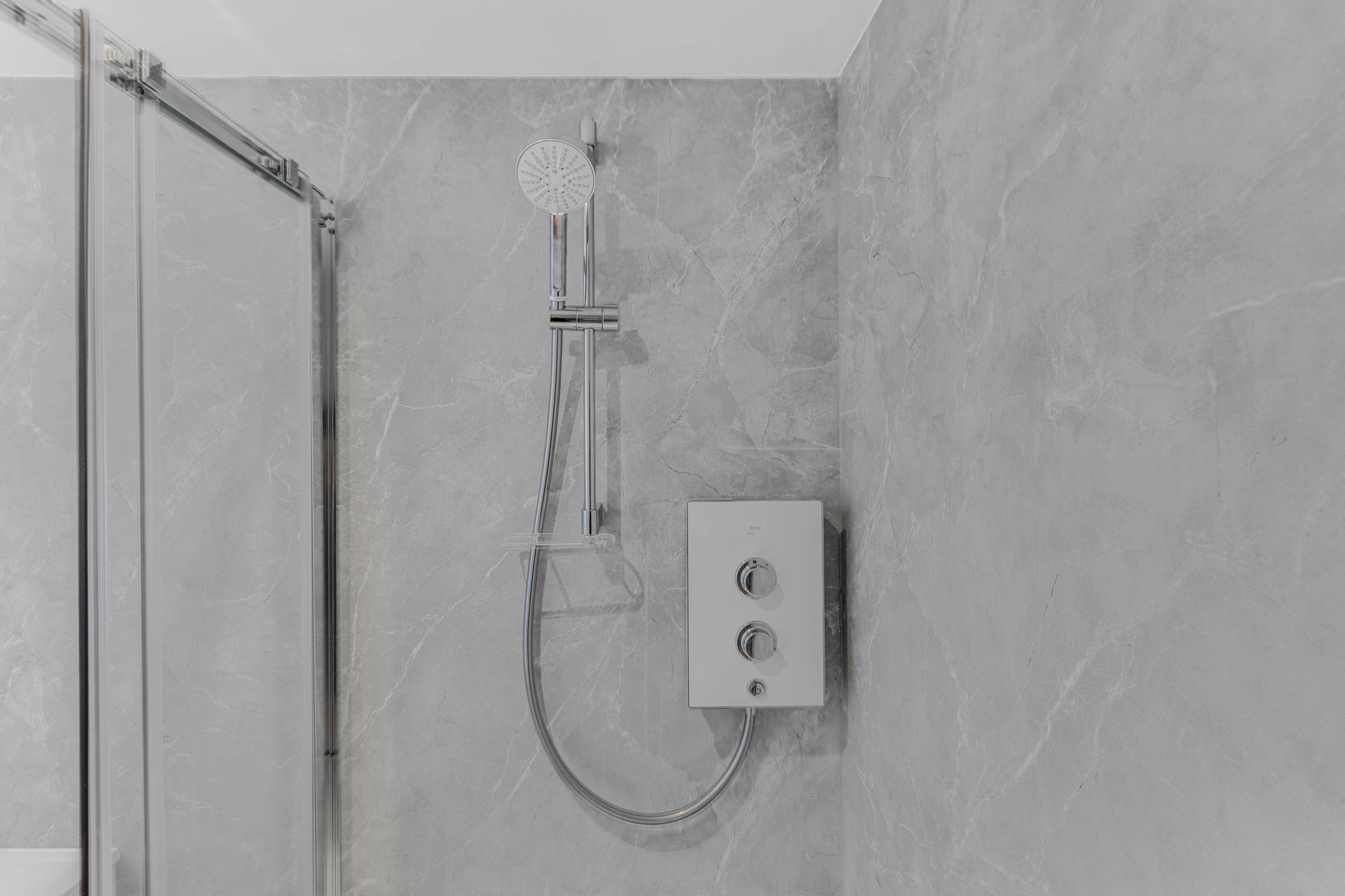 Bespoke garden annexe Washroom Design with modern appliances and clean worktops