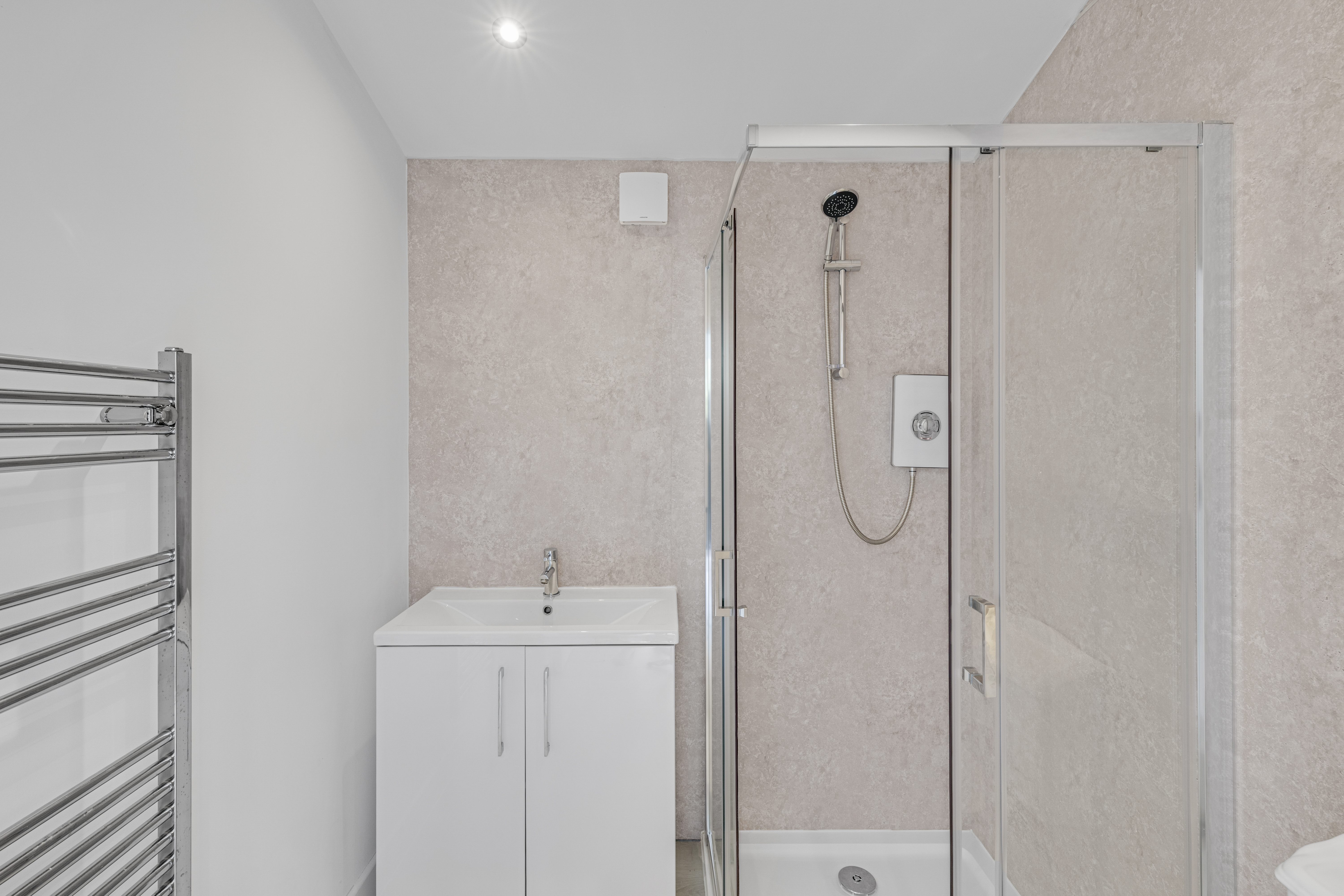 Bespoke garden annexe Washroom Design with modern appliances and clean worktops