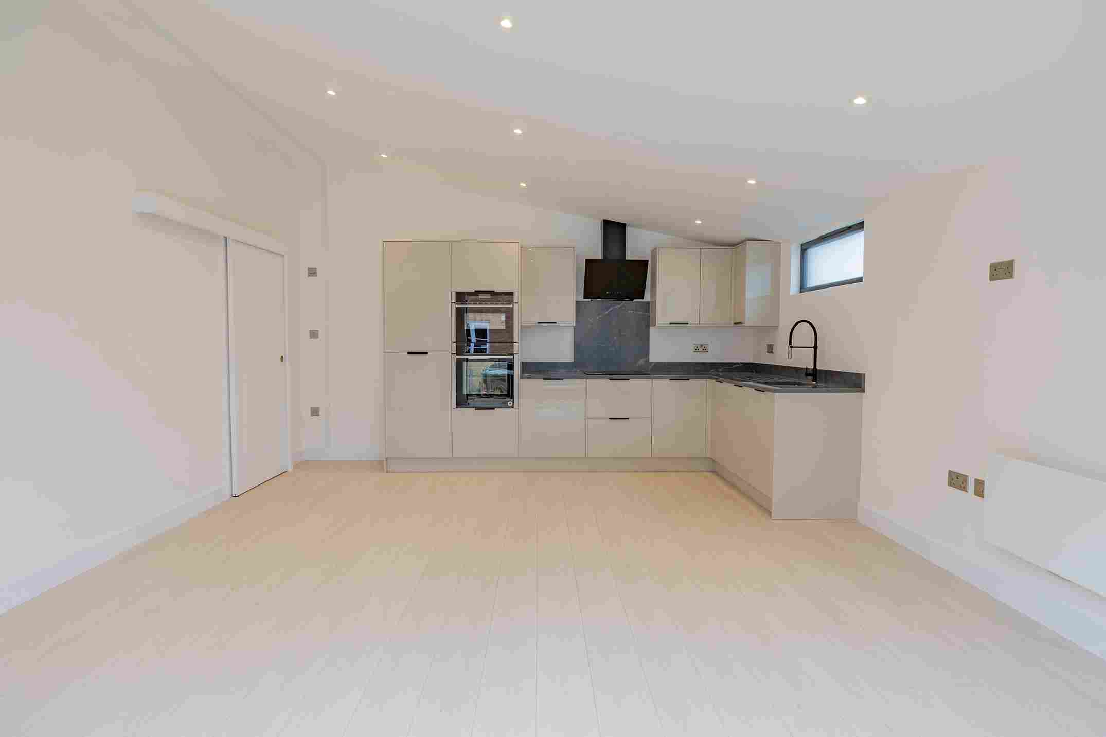Garden annexe bedroom with natural daylight and modern home styling